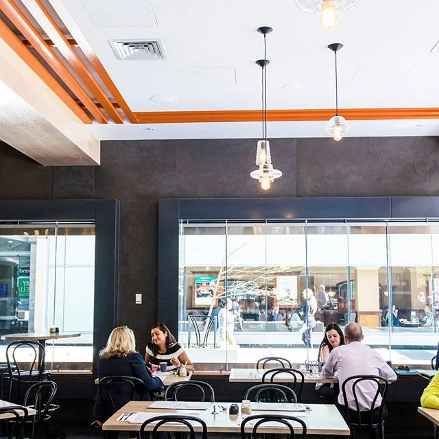 Guests gathered around the tables inside Basilica café